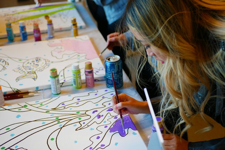 Woman in an art club painting