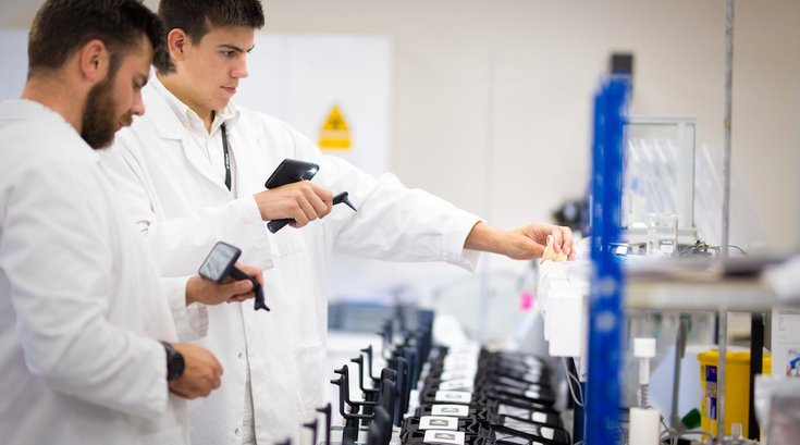 researchers in lab flu vaccine unsplash 