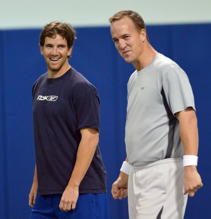 Eli takes picture with fan wearing 'Double Bird' jersey