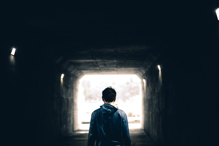 Man standing in tunnel