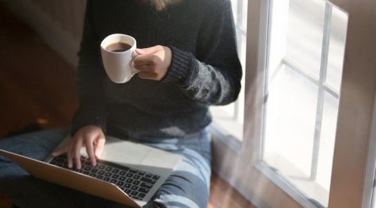 woman on laptop with coffee
