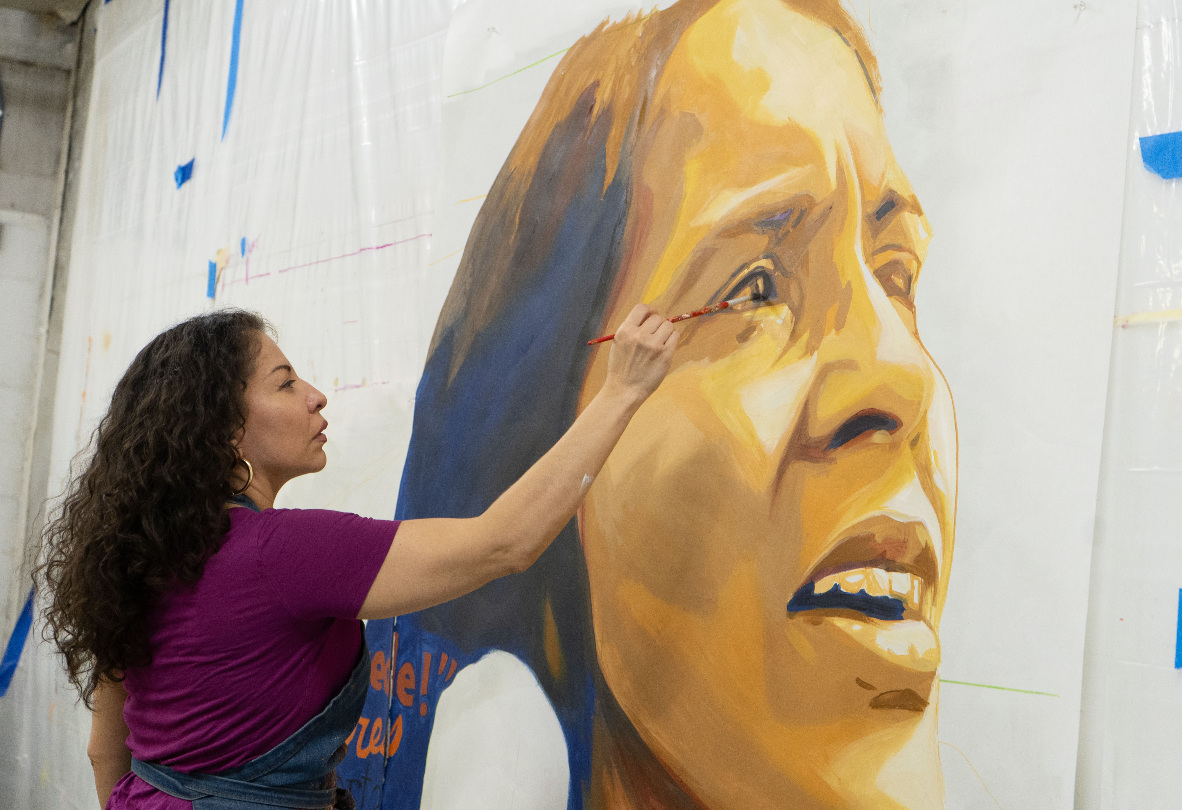Artist hopes painting over image of César Chávez in a Fairhill mural helps reframe his movement